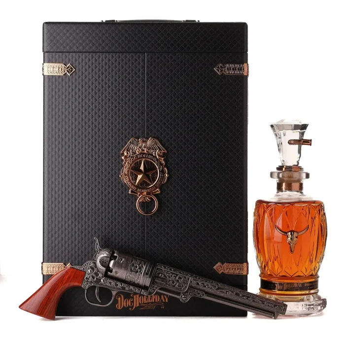 The closed case under its copper badge, the revolver and the filled decanter beside it.